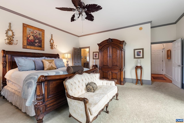 carpeted bedroom with ceiling fan and crown molding