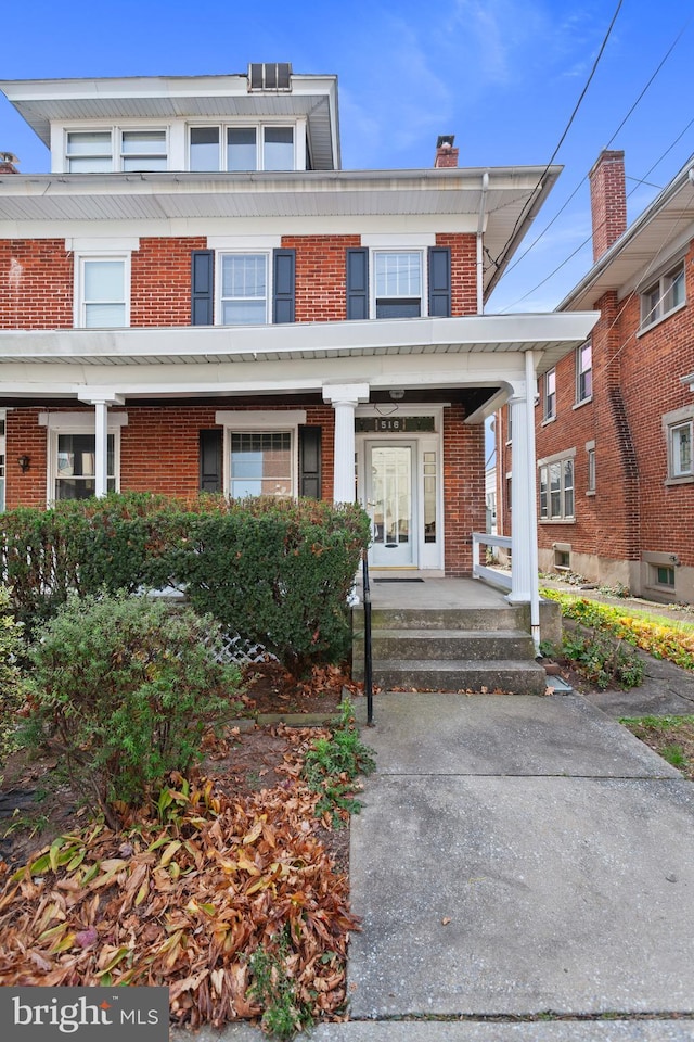 multi unit property featuring a porch