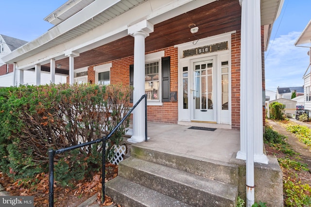 doorway to property with a porch