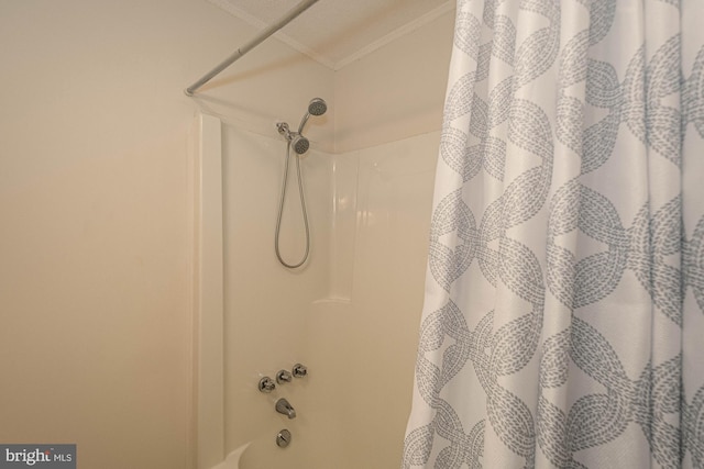 details featuring shower / bathtub combination with curtain