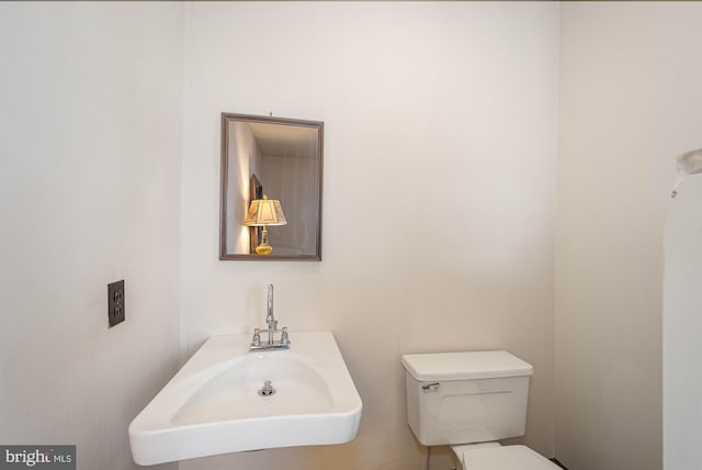 bathroom with toilet and sink