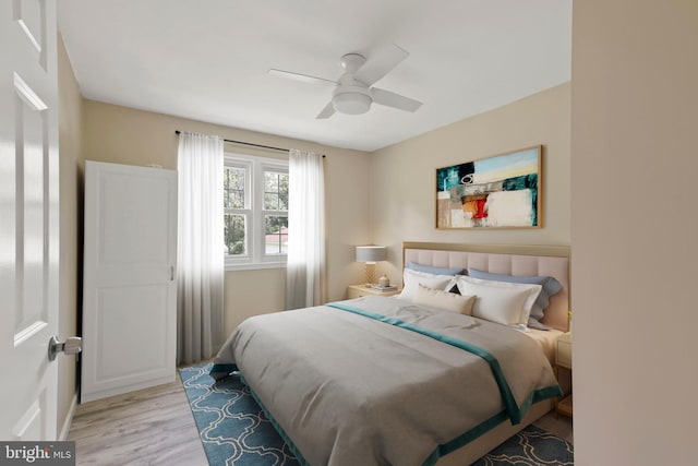 bedroom featuring ceiling fan and light wood-type flooring