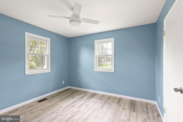 spare room with ceiling fan and light hardwood / wood-style flooring