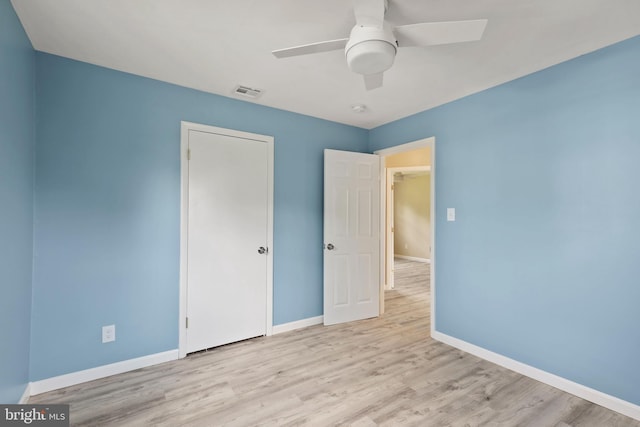 unfurnished bedroom featuring ceiling fan and light hardwood / wood-style floors