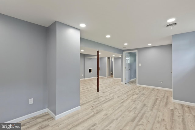 basement featuring light hardwood / wood-style floors