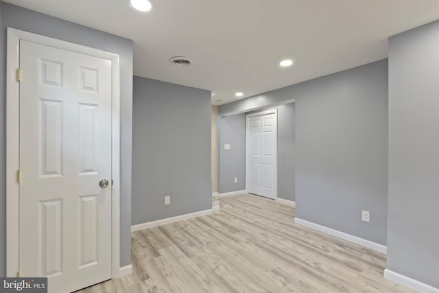 unfurnished room featuring light wood-type flooring