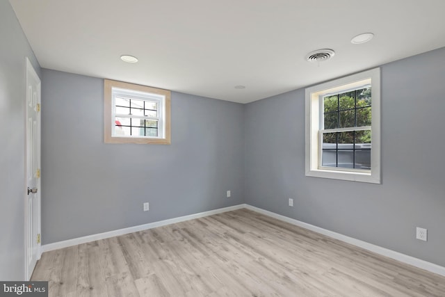 spare room with light wood-type flooring