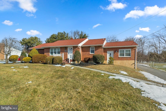 ranch-style house with a front lawn