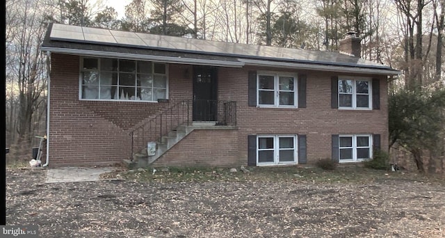 view of front of house with solar panels