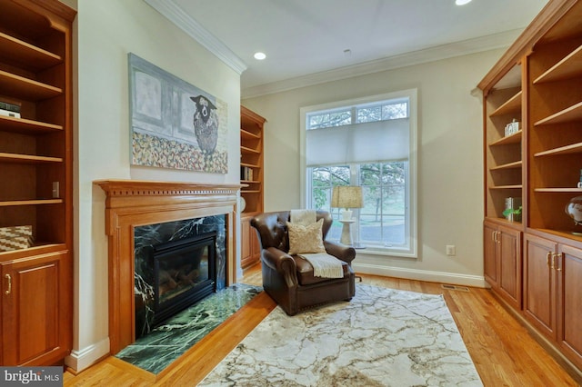 17061 Spring Creek Ln, Leesburg, VA 20176 - sitting room with ornamental molding, light wood-style floors, a fireplace, baseboards, and recessed lighting
