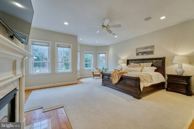 17061 Spring Creek Ln, Leesburg, VA 20176 - bedroom with a tile fireplace, baseboards, recessed lighting, and a ceiling fan