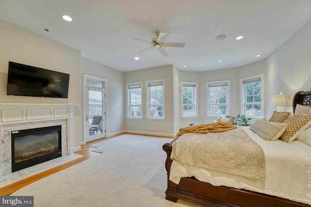 17061 Spring Creek Ln, Leesburg, VA 20176 - bedroom featuring multiple windows, access to outside, a premium fireplace, recessed lighting, and baseboards