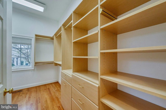 17061 Spring Creek Ln, Leesburg, VA 20176 - walk in closet with light wood-type flooring