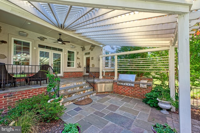 view of patio featuring ceiling fan, area for grilling, and grilling area