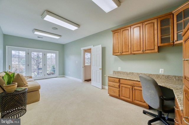 17061 Spring Creek Ln, Leesburg, VA 20176 - office area with built in study area, light carpet, baseboards, and french doors