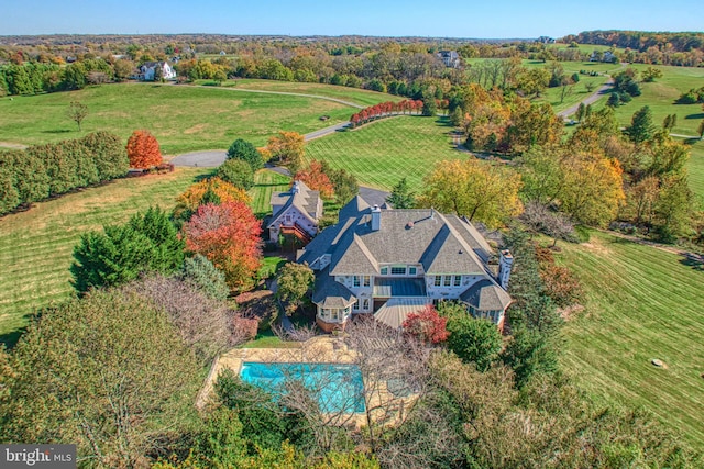 birds eye view of property with a rural view