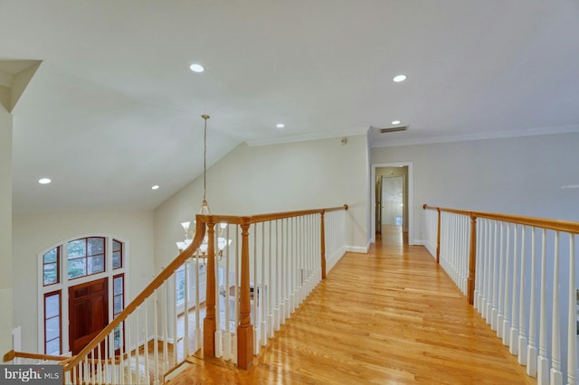 17061 Spring Creek Ln, Leesburg, VA 20176 - hall with light wood-style floors, recessed lighting, a chandelier, ornamental molding, and baseboards