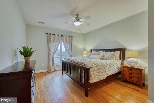 17061 Spring Creek Ln, Leesburg, VA 20176 - bedroom with wood finished floors, baseboards, and ceiling fan