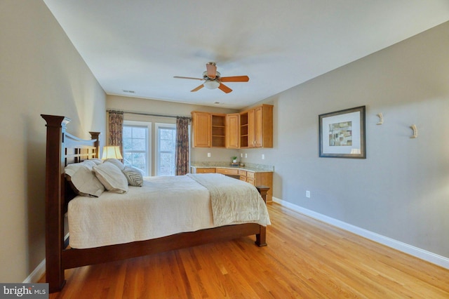 17061 Spring Creek Ln, Leesburg, VA 20176 - bedroom with baseboards, light wood finished floors, and a ceiling fan