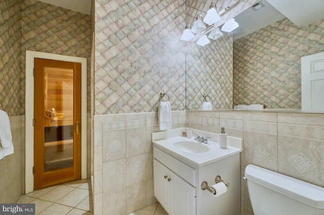 17061 Spring Creek Ln, Leesburg, VA 20176 - half bath with tile walls, tile patterned floors, vanity, and toilet
