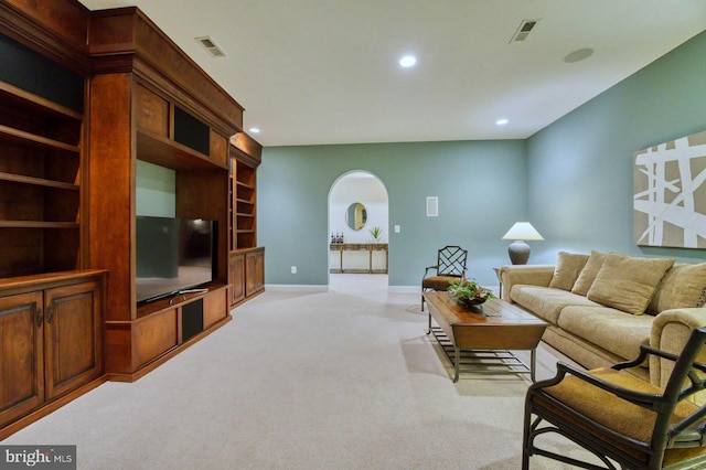 17061 Spring Creek Ln, Leesburg, VA 20176 - living room featuring arched walkways, light carpet, recessed lighting, and baseboards