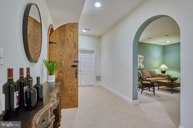 17061 Spring Creek Ln, Leesburg, VA 20176 - hallway with arched walkways, carpet flooring, baseboards, and recessed lighting