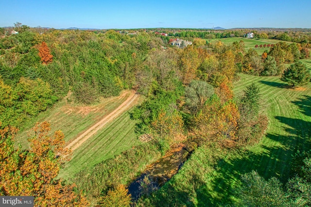 birds eye view of property with a rural view