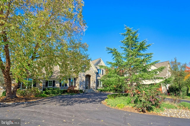 view of property hidden behind natural elements