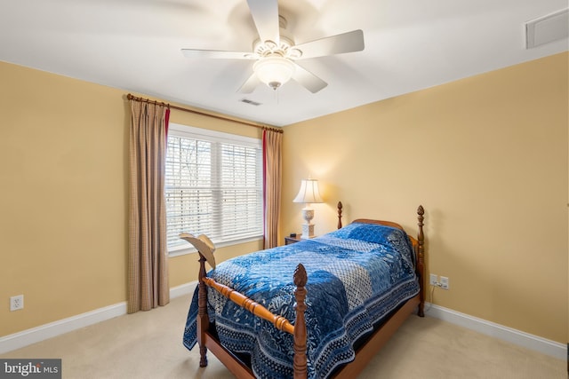 bedroom featuring ceiling fan and light carpet