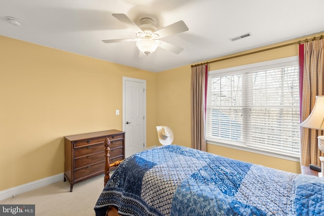 carpeted bedroom with ceiling fan