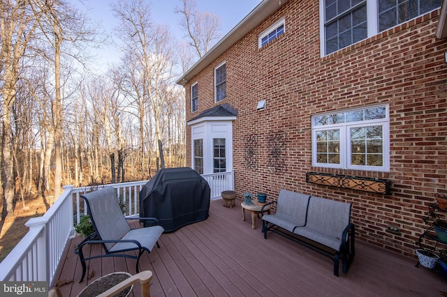 wooden terrace featuring area for grilling