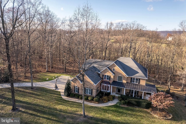 view of front facade featuring a front lawn and a porch