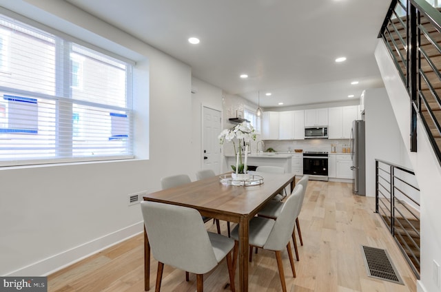 dining area featuring light hardwood / wood-style flooring