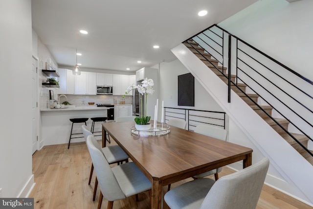 dining room with light hardwood / wood-style flooring