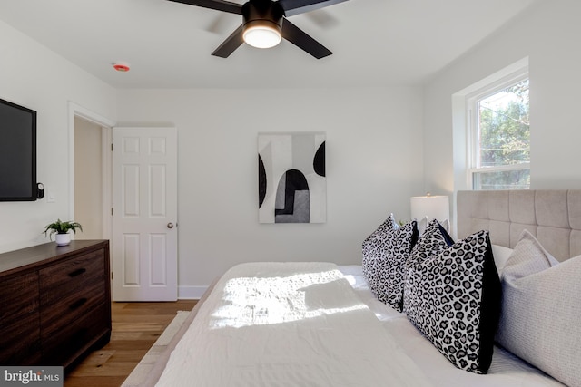 bedroom featuring hardwood / wood-style flooring and ceiling fan