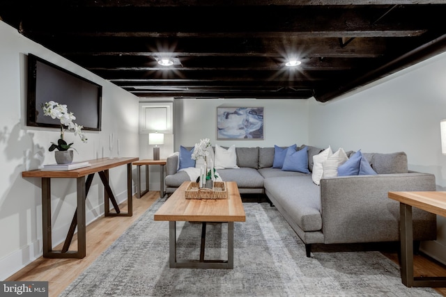 living room featuring wood-type flooring and wooden ceiling