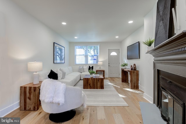 living room with light hardwood / wood-style floors