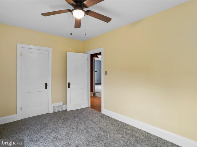 unfurnished bedroom featuring carpet flooring and ceiling fan