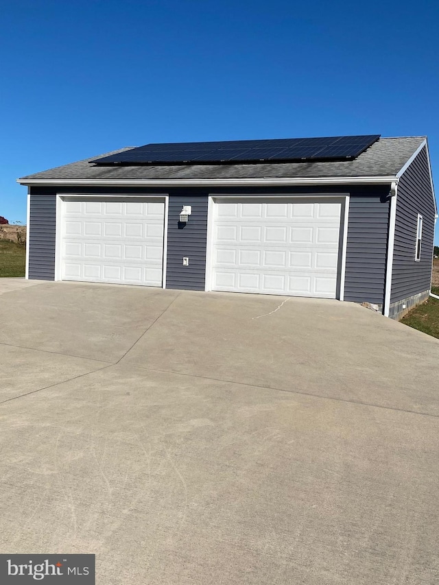 garage featuring solar panels