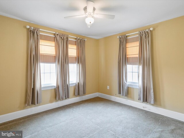 empty room featuring carpet and ceiling fan