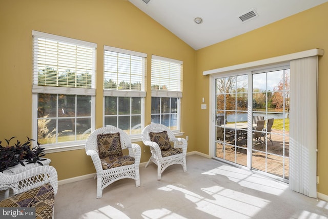 sunroom / solarium featuring vaulted ceiling