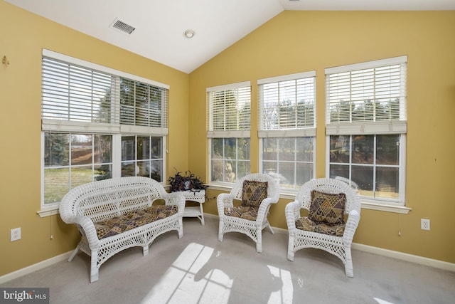 sunroom featuring lofted ceiling