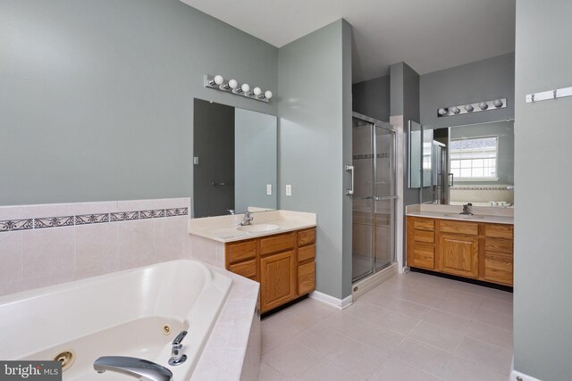 bathroom with vanity, tile patterned floors, and shower with separate bathtub