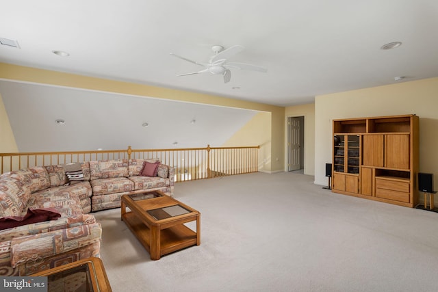 carpeted living room with ceiling fan