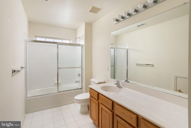 full bathroom with enclosed tub / shower combo, vanity, toilet, and tile patterned flooring