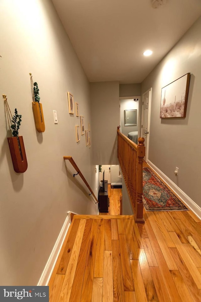 staircase featuring hardwood / wood-style floors