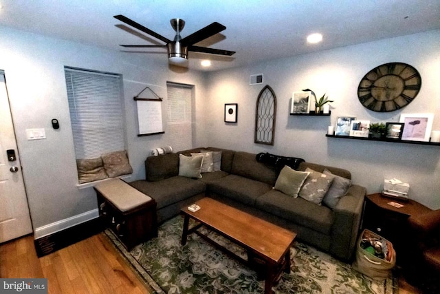 living room with ceiling fan and hardwood / wood-style floors