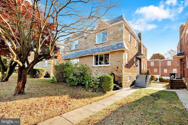 exterior space with a front yard