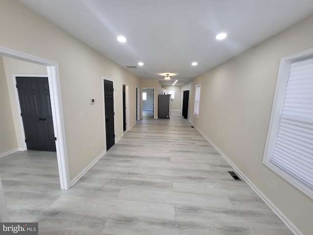 hall featuring light wood-type flooring