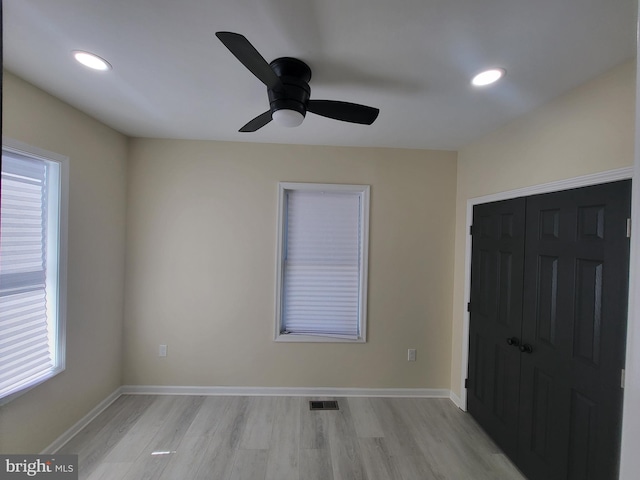 unfurnished room with ceiling fan and light hardwood / wood-style flooring